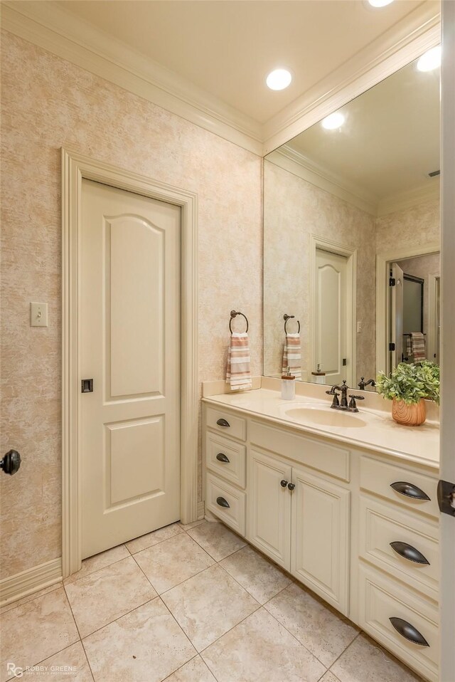 bathroom featuring tile patterned flooring, vanity, and ornamental molding