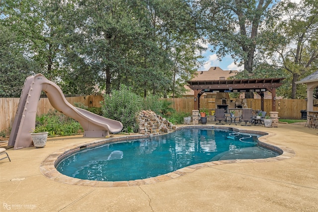 view of swimming pool with a patio and a water slide