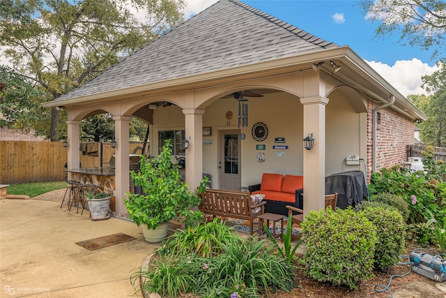 view of patio / terrace featuring an outdoor living space and an outdoor bar