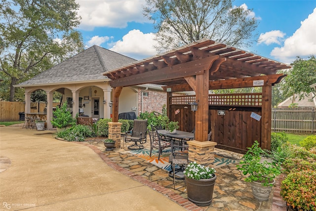 view of patio with a pergola and an outdoor bar