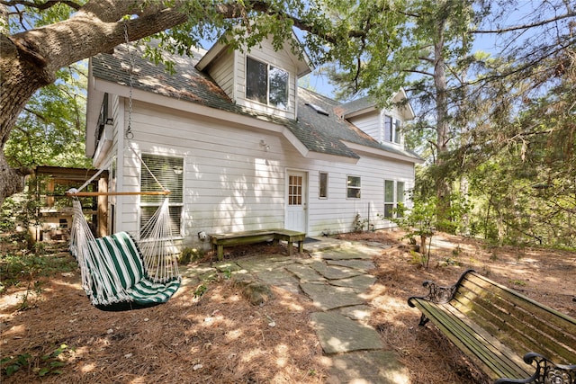 rear view of house featuring a patio