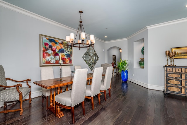 dining area with a notable chandelier, dark hardwood / wood-style floors, and ornamental molding