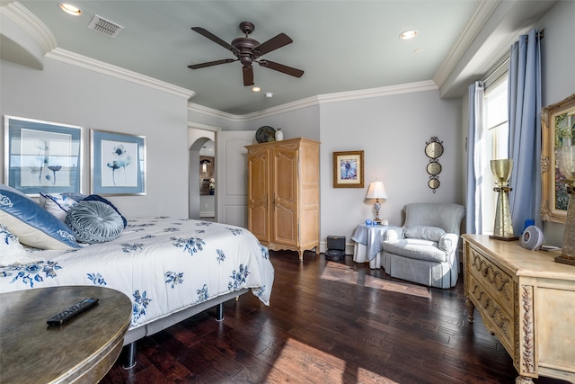 bedroom featuring ornamental molding, dark hardwood / wood-style floors, and ceiling fan