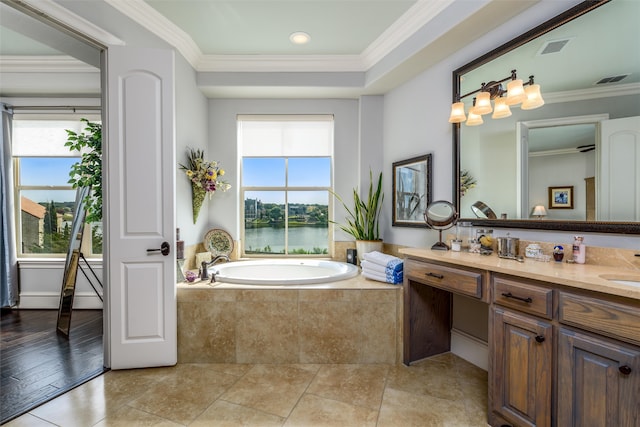 bathroom featuring vanity, tiled tub, hardwood / wood-style flooring, crown molding, and a water view