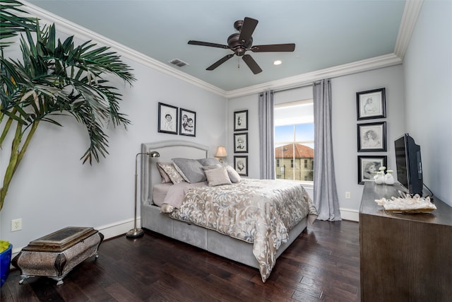 bedroom featuring ceiling fan, crown molding, and dark hardwood / wood-style flooring