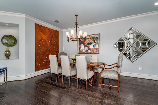 dining space featuring ornamental molding, dark wood-type flooring, and a notable chandelier