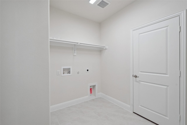 clothes washing area featuring gas dryer hookup, hookup for a washing machine, and electric dryer hookup