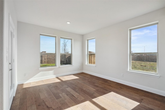 unfurnished room featuring dark wood-type flooring