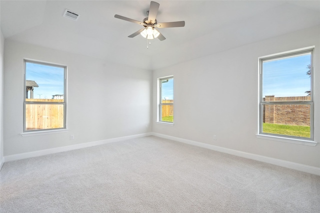 spare room with carpet floors and ceiling fan