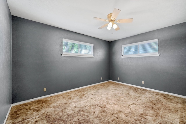 carpeted empty room with ceiling fan