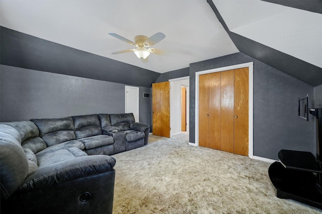 carpeted living room with lofted ceiling and ceiling fan