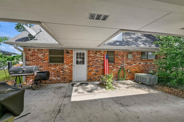 view of patio featuring grilling area and central air condition unit