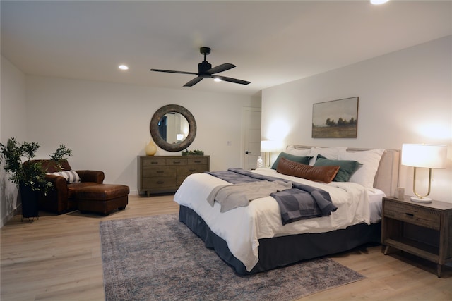 bedroom with light wood-type flooring and ceiling fan