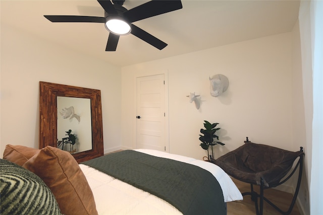 bedroom featuring ceiling fan and hardwood / wood-style floors