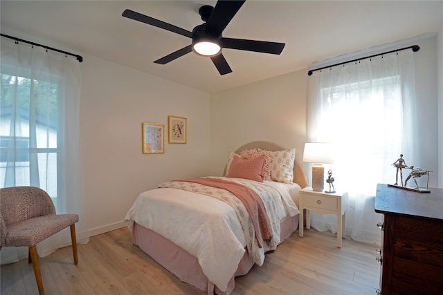 bedroom featuring ceiling fan and light hardwood / wood-style flooring