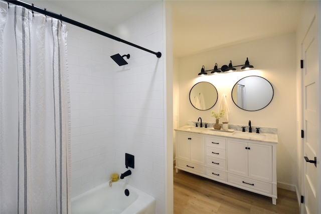 bathroom featuring wood-type flooring, vanity, and shower / tub combo with curtain