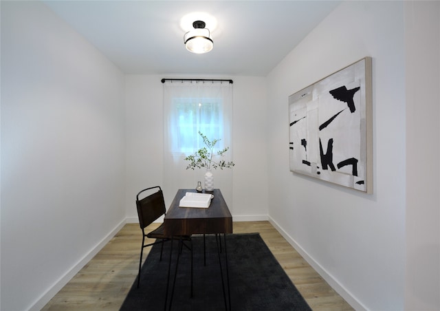 office with light hardwood / wood-style flooring