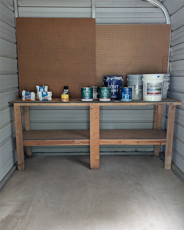 garage featuring wood walls