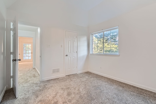 unfurnished bedroom with light carpet