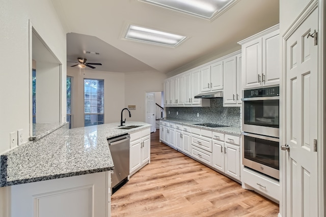 kitchen with ceiling fan, sink, light hardwood / wood-style flooring, white cabinetry, and appliances with stainless steel finishes