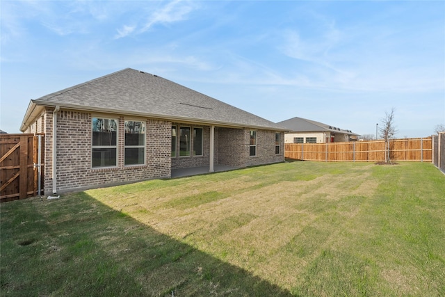 2805 Spring Valley Dr, Anna, TX 75409 - back of house featuring brick siding, a fenced backyard, a shingled roof, and a patio area