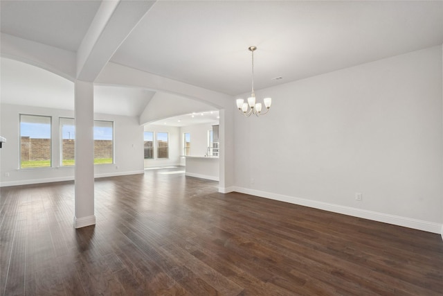 2805 Spring Valley Dr, Anna, TX 75409 - unfurnished living room featuring healthy amount of natural light, a chandelier, dark wood-type flooring, and beamed ceiling