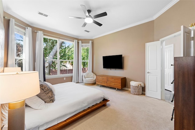 bedroom featuring light carpet, ceiling fan, and ornamental molding