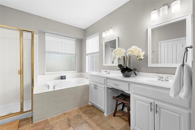 bathroom featuring independent shower and bath and vanity