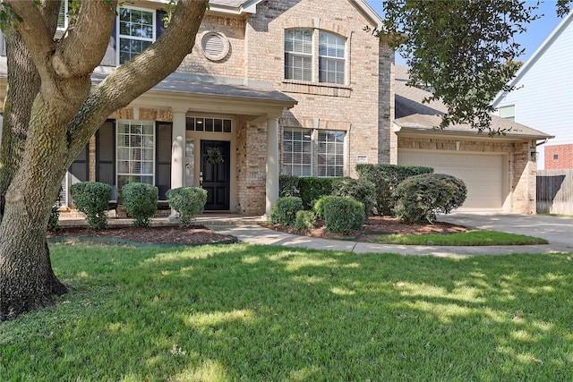 view of front facade with a front yard and a garage