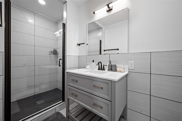 bathroom featuring backsplash, a shower with door, and vanity