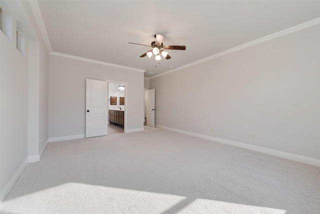 unfurnished bedroom with ceiling fan, ensuite bathroom, ornamental molding, and light carpet