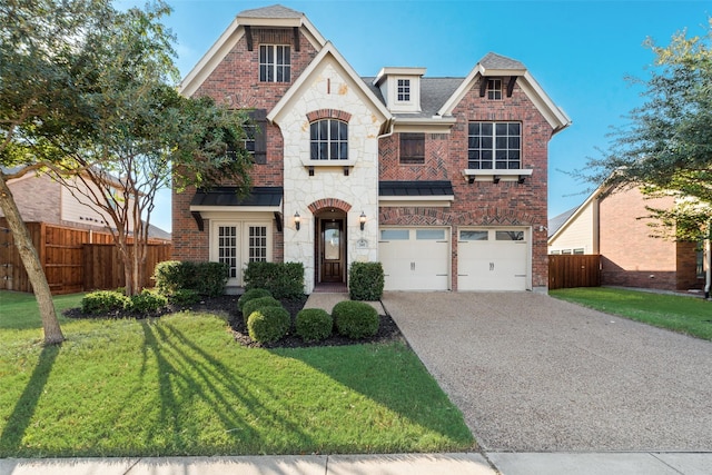 view of front of home featuring a garage and a front yard