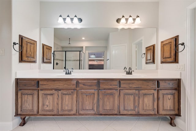 bathroom featuring vanity, tile patterned floors, and an enclosed shower