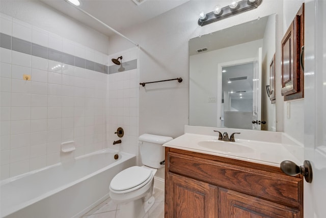 full bathroom featuring tile patterned floors, vanity, bathtub / shower combination, and toilet