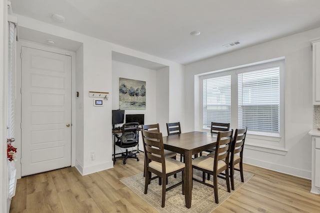 dining room with light wood-type flooring