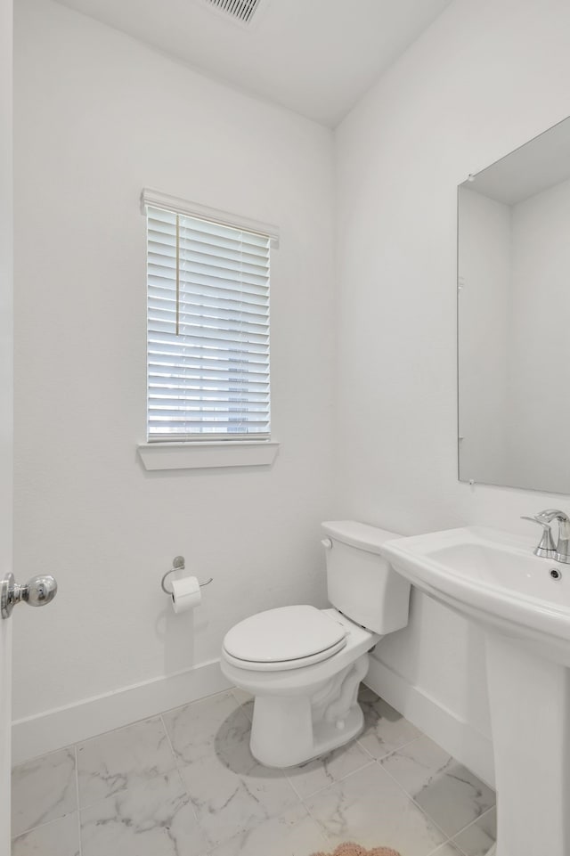 bathroom featuring toilet