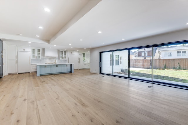 unfurnished living room featuring light hardwood / wood-style flooring