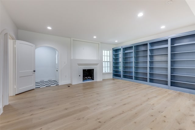 unfurnished living room featuring light wood-type flooring