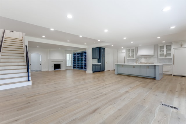 unfurnished living room with light wood-type flooring