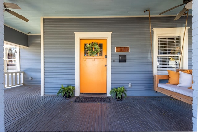 entrance to property featuring ceiling fan