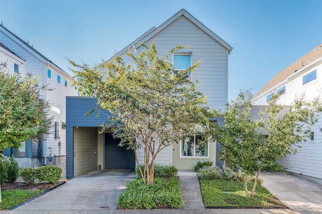 view of front of house featuring a carport and a garage