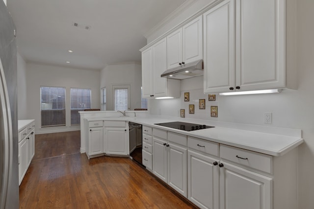 kitchen featuring dark hardwood / wood-style floors, sink, white cabinets, kitchen peninsula, and black appliances