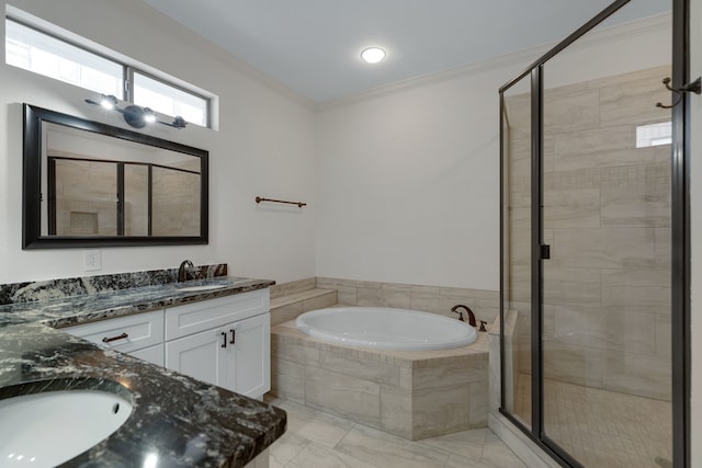 bathroom featuring crown molding, vanity, and separate shower and tub