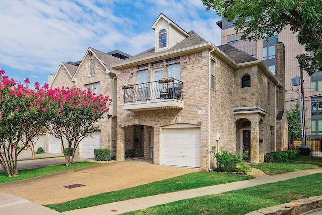 view of front of property with a balcony and a garage