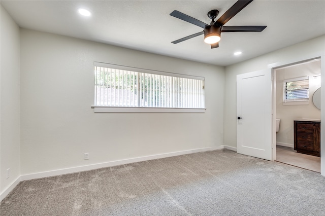 unfurnished bedroom with multiple windows, ceiling fan, and carpet floors