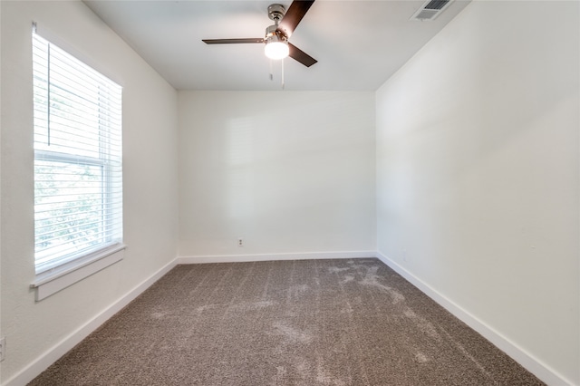 unfurnished room featuring ceiling fan and carpet floors