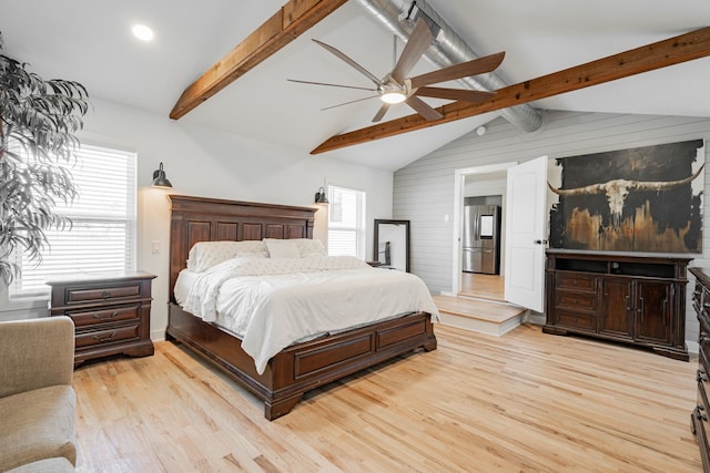 bedroom with lofted ceiling with beams, light wood-type flooring, ceiling fan, and stainless steel fridge