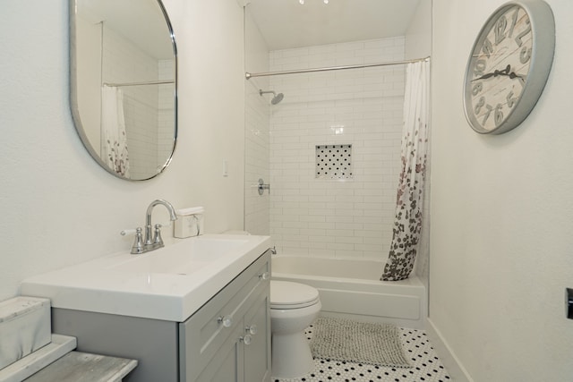 full bathroom featuring tile patterned flooring, vanity, toilet, and shower / bath combination with curtain