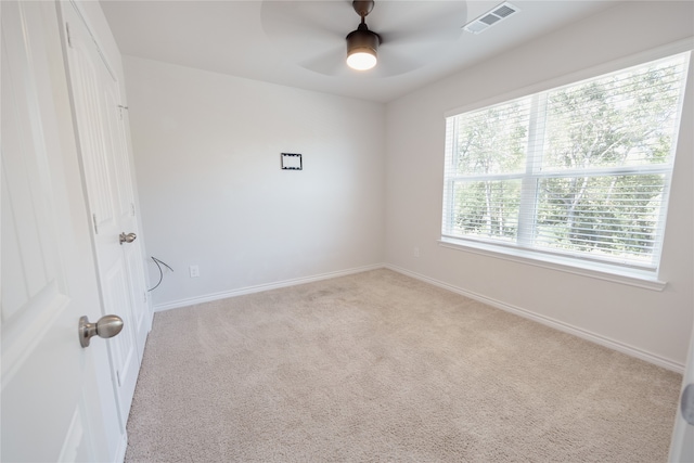 carpeted empty room with ceiling fan