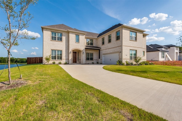 view of front of house featuring a front yard and a garage